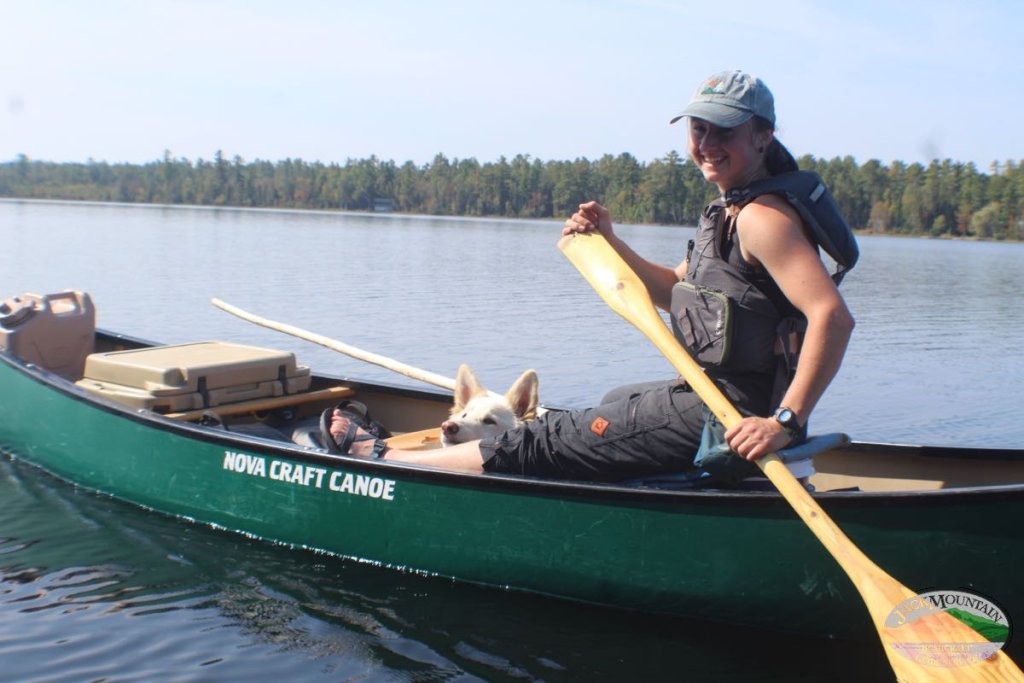 Sam canoeing on a northern Maine lake